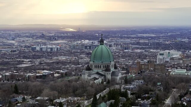 Aerial view of St. Josephs Oratory of Mount Royal at Sunset in winter. Montreal, Quebec, Canada