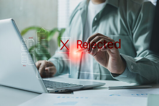 Business professional rejecting digital document on laptop with red cross interface, online workflow failure, rejected approval process concept, corporate error management and compliance issue system