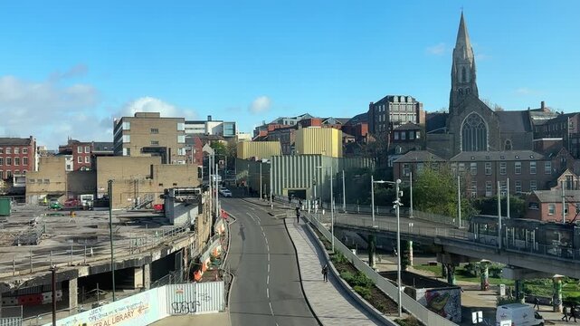 Overlooking a Nottingham tram with the city skyline in the background. A dynamic urban scene capturing public transport and Nottingham cityscape, Nottinghamshire, East Midlands, England, UK.