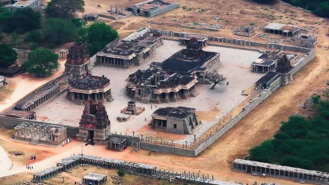 Shree Vijaya Vitthala Temple with Vitthal Mandirv, Purandara mantapa and The Stone Chariot at nimbapura, hampi, karnataka, india. day time, semi orbit shot, drone shot, 4k.