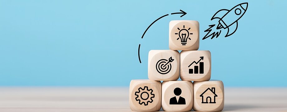 A stack of wooden blocks with business and growth symbols on a blue background with a rocket ship