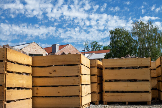 Large wooden crates containing stone paving blocks
