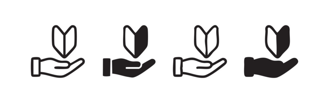 Beginner or novice mark icon set held by a hand in various artistic styles, symbolizing a new user or learner