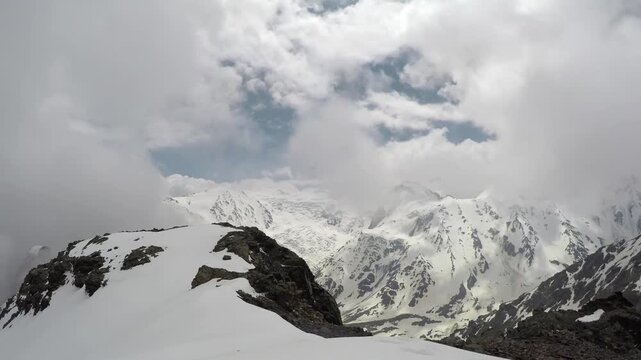 Caucasus, North Ossetia. Genaldon Gorge. High snow-capped mountains, timelapse.