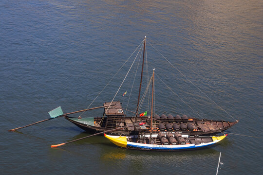 Rabelo boats with barrels floating on Douro river
