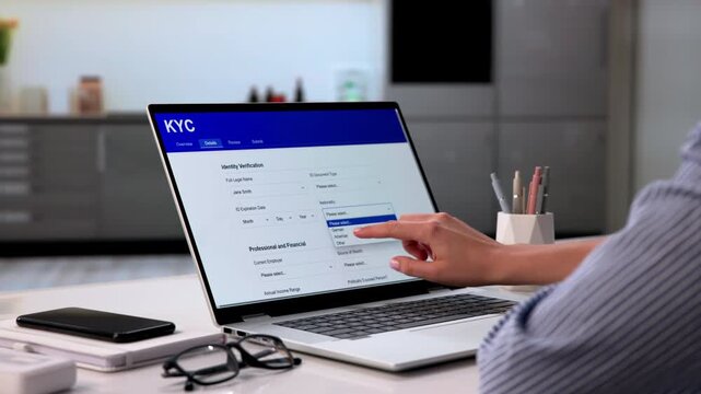 Woman Filling Out FYC Form Online At Home