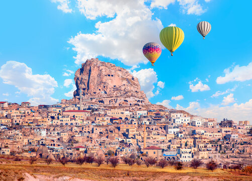 Hot air balloon flying over spectacular Cappadocia at sunset - Goreme, Turkey