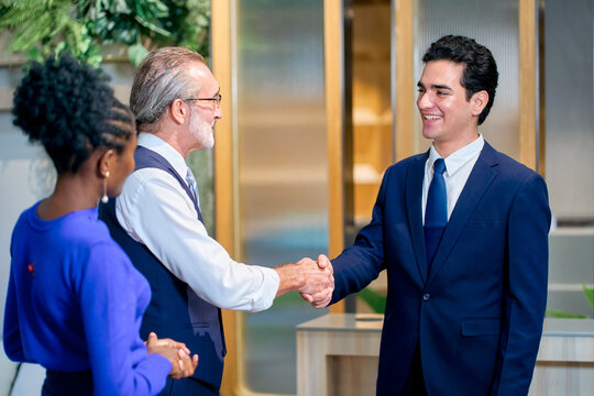 Business people shake hand for commit business deal or new member work in new office.