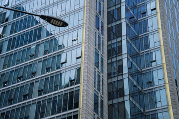 Obraz premium Architecture details Glass wall Modern building exterior Abstract futuristic background