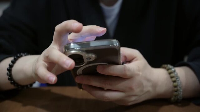 Hand of asian girl using testing phone, close up of hands. Mobile testing, online services concept, freelancing, social media promotion