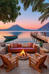 Fototapeta premium Bonfire on a lakeside patio with wooden chairs, dock, boat and volcano view at sunset