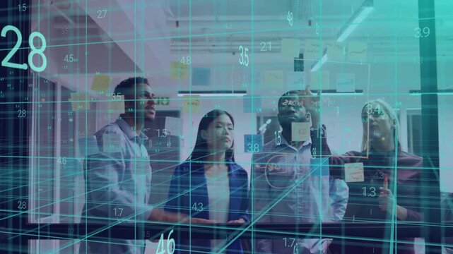 Man gesturing at projected metrics, team pointing, placing note on glass, annotating business data