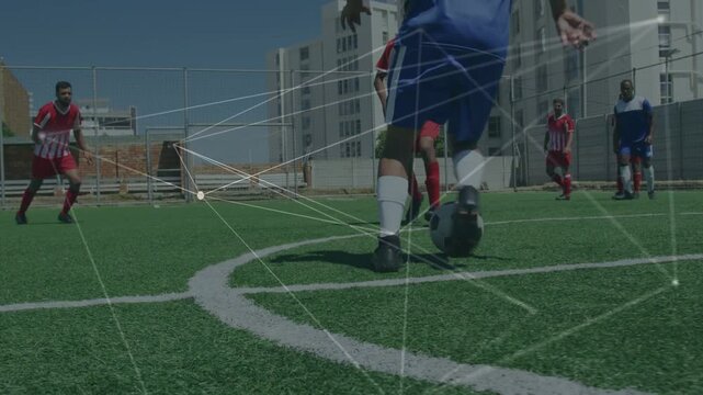 Soccer player in blue pivoting, dribbling, evading sliding tackle, overlay tracking ball advancing