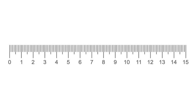 A close-up view of a ruler measuring length on a flat surface indoors.