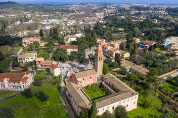Fototapeta premium Scenic aerial landscape view of the rural settlement of Kompitsi featuring scattered homes and vast green vegetation in Corfu, Greece