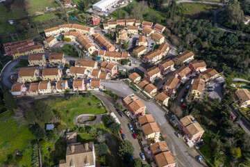 Fototapeta premium Drone Panorama of Kompitsi Village on Corfu Island, Greece. High Angle View of Traditional Stone Houses, Historic Mansions, and Lush Green Mediterranean Hillsides in the Rural Ionian Countryside