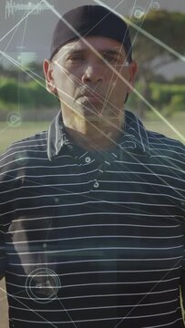 Vertical video: Man removing black strap in sunny field technology HUD tracking head for comfort