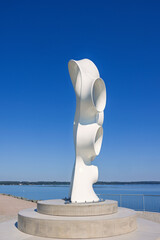 Fototapeta premium Modern artwork on a pier with by a lake