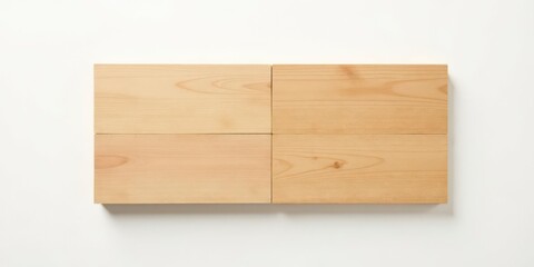 Naklejka premium Four Light-Colored Wooden Blocks Arranged in a Grid on a White Background