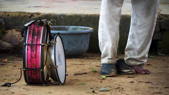 Indian Percussion Instruments Resting on Floor in Rural Setting