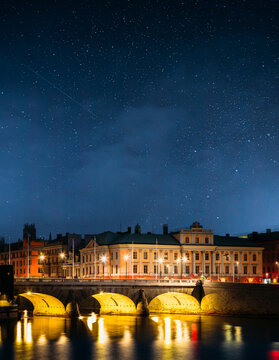 Night View Of Illuminated Old Norrbro Bridge In Stockholm, Sweden