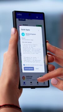 Young Woman Holds Smartphone Browsing Online Job Applications