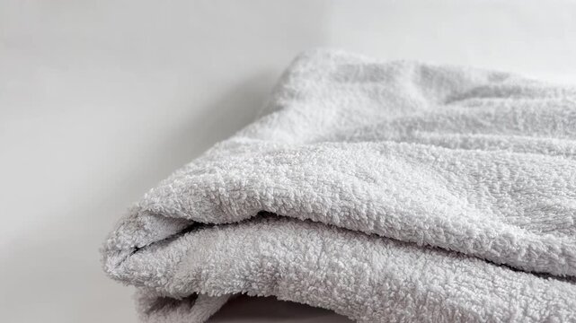 Clean folded towels arranged in organized stacks bring a fresh spa feeling to any bathroom, hotel, or domestic storage space.