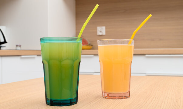Colorful drinks in glasses, isotonic drink after training