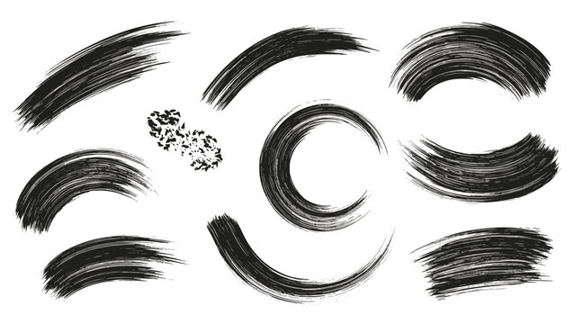Artistic set of curved black brush strokes and paint splatters, perfect for creating dynamic and abstract circular compositions.