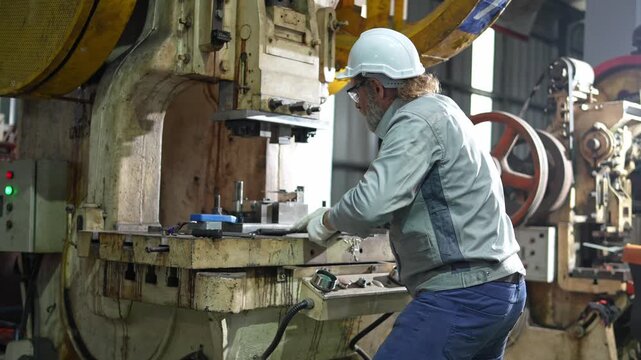 Machinery operation by skilled technician industrial workshop photography manufacturing environment close-up view precision work