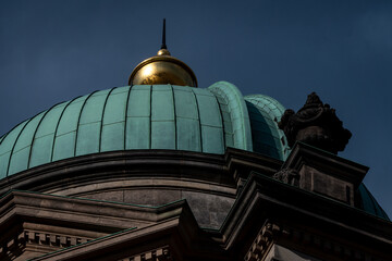 Historic patinated side dome with lantern in warm light, Berlin © Jrg