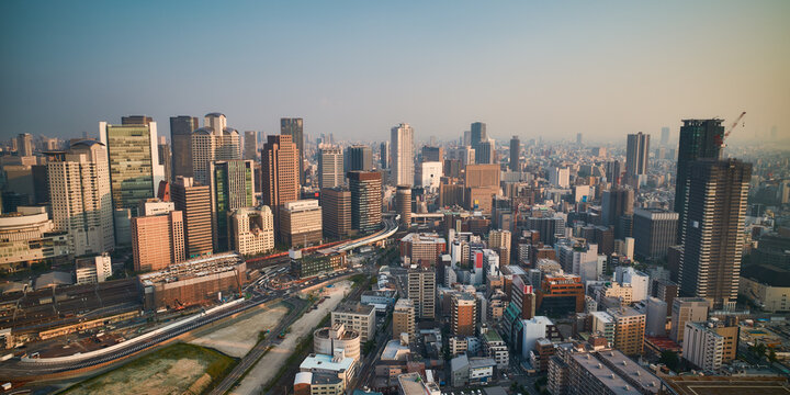 Osaka city skyline - asia modern business city, cityscape birds eye view at sunset, shot in Umeda sky building, Osaka, Japan.