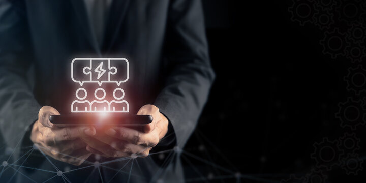 Partner and Team Integration Concept. Holding device with team and connection icons, symbolizing partner integration, collaboration and unified teamwork in a digital business environment.