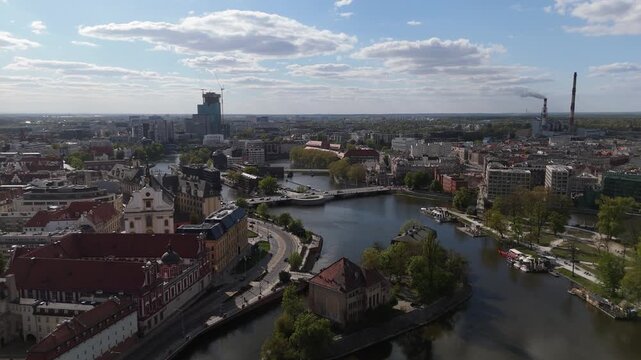 Aerial view drone flying over Wroclaw touristic city center, churches, islands and Odra river at sunny summer day