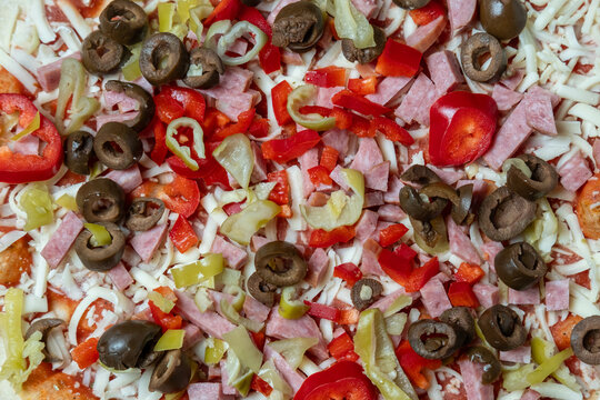 Detailed food closeup. Closeup of savory toppings. Highresolution image showcasing colorful pizza toppings textures