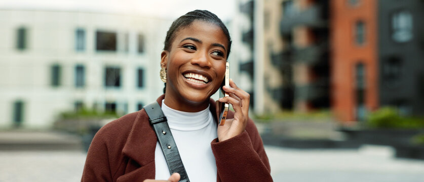 Smile, business or black woman with phone call in city, settlement offer negotiation or case update. Space, consulting client or lawyer with mobile for hearing arrangement, town or billing discussion