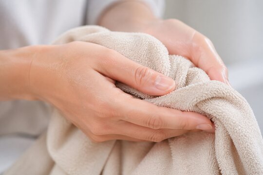 Close up of hands getting tried with towel