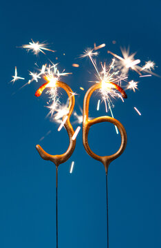 36 years celebration festive background made with Bengal fires in the form of number Thirty six. Vertical photography.
