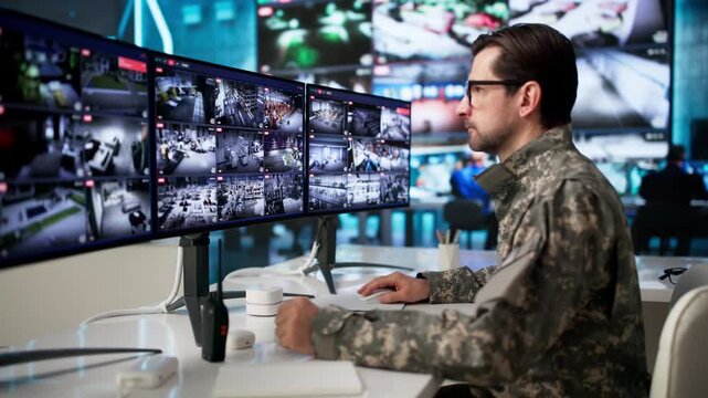 Man In Military Uniform Operates Computer System