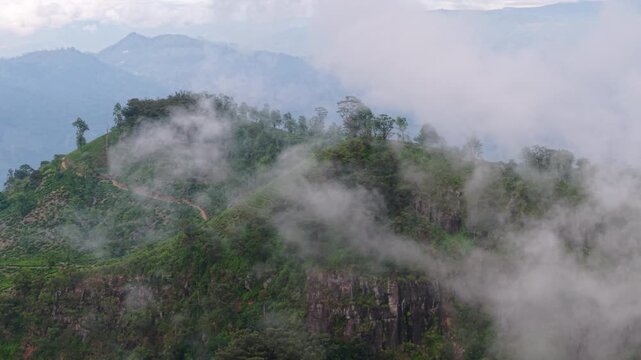 Wispy Fog Clouds On The Summit Of Narangala Mountain In Badulla, Sri Lanka. Aerial Shot