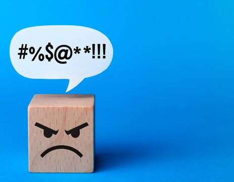 Angry Wooden Block with Expletives in Speech Bubble on Blue Background.