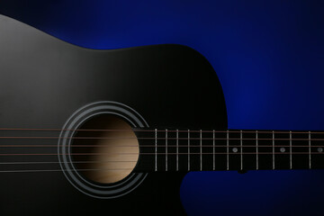 Obraz premium Modern guitar on dark background, closeup