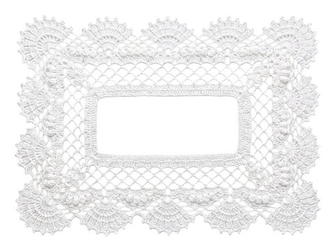Intricate white lace doily, rectangular shape with ornate patterned edge.