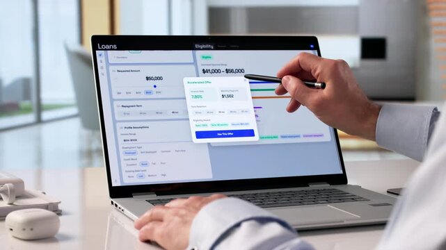 Man Uses Laptop To Check Personal Loan Eligibility