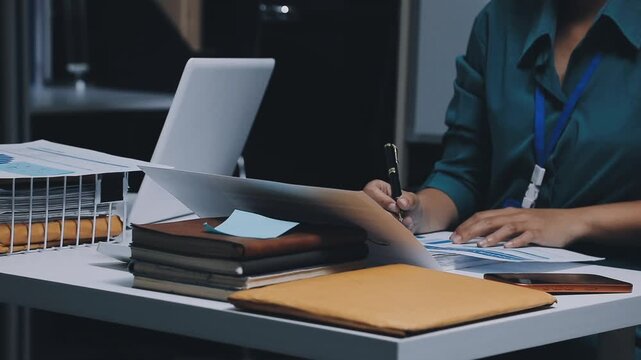 Auditor and accountant team working in office, analyze financial data and accounting record with calculator. Accounting company provide finance and taxation planning for profitable cash flow