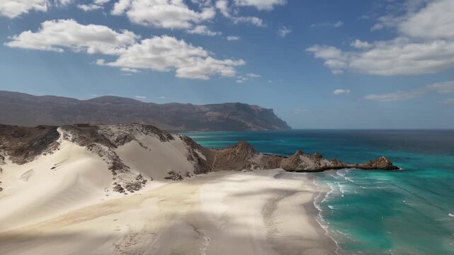 Sand Dunes Overlooking Turquoise Coastal Bay and Mountains. Detwah Lagoon, Sokotra, Yemen.