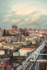 Obraz premium Porto's historic center reveals a stunning skyline, rich with colorful buildings and a bustling metro line