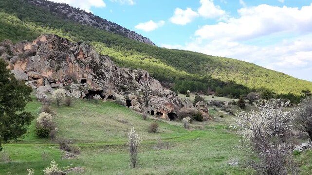 Inkaya or Inyayla is a lesser-known but impressive rock settlement in the Phrygian highlands near Seyitgazi, featuring volcanic tuff formations carved by Phrygians, later reused by Roman and Byzantine
