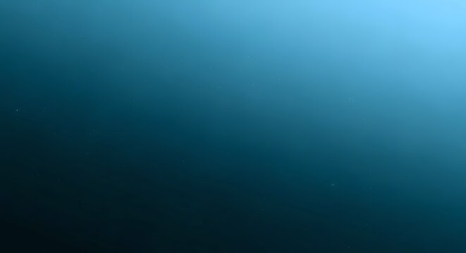 A serene underwater scene with a gradient of deep blue to light blue, suggesting depth and tranquility.