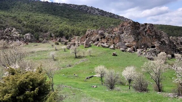 Inkaya or Inyayla is a lesser-known but impressive rock settlement in the Phrygian highlands near Seyitgazi, featuring volcanic tuff formations carved by Phrygians, later reused by Roman and Byzantine